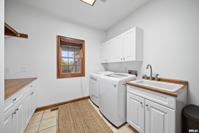 5 High Point Pl, Bettendorf, IA 52722 - washroom featuring cabinet space, independent washer and dryer, and light tile patterned flooring