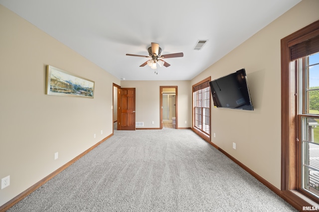 5 High Point Pl, Bettendorf, IA 52722 - unfurnished living room with a ceiling fan and light carpet