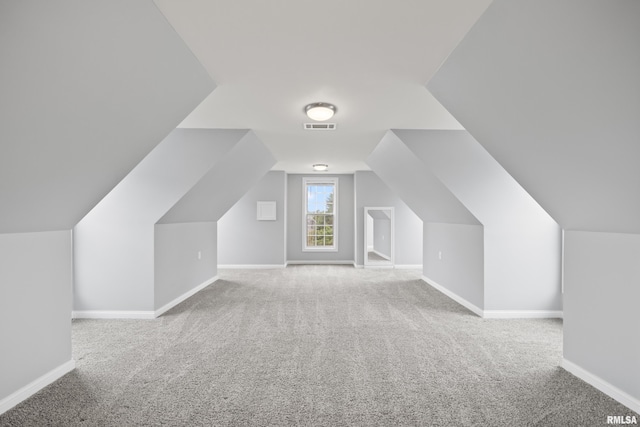 5 High Point Pl, Bettendorf, IA 52722 - additional living space with carpet floors and vaulted ceiling