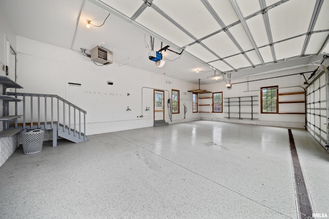 5 High Point Pl, Bettendorf, IA 52722 - garage featuring a heating unit and a garage door opener