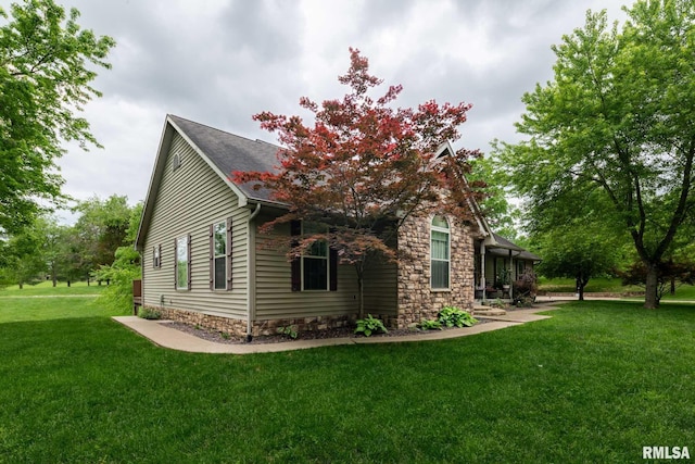 1300 W Brewster Rd, Herrin, IL 62948 - view of home's exterior with a yard and stone siding