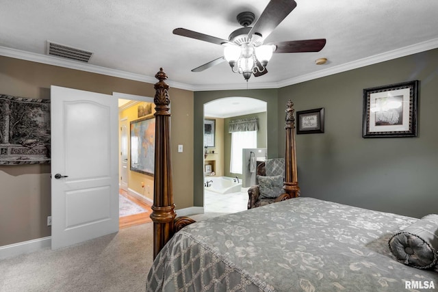 1300 W Brewster Rd, Herrin, IL 62948 - bedroom featuring arched walkways, crown molding, carpet, and ceiling fan