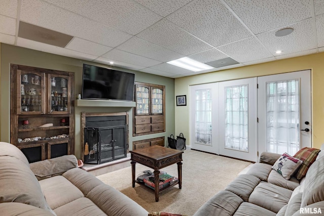 1300 W Brewster Rd, Herrin, IL 62948 - living room featuring a paneled ceiling, a glass covered fireplace, and carpet