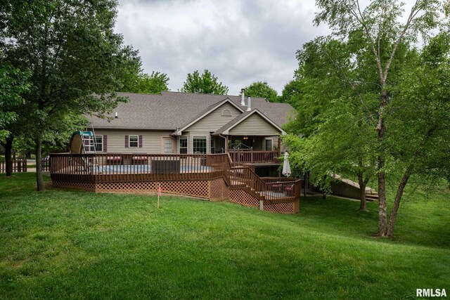 1300 W Brewster Rd, Herrin, IL 62948 - back of property with a wooden deck, a lawn, a chimney, roof with shingles, and stairs