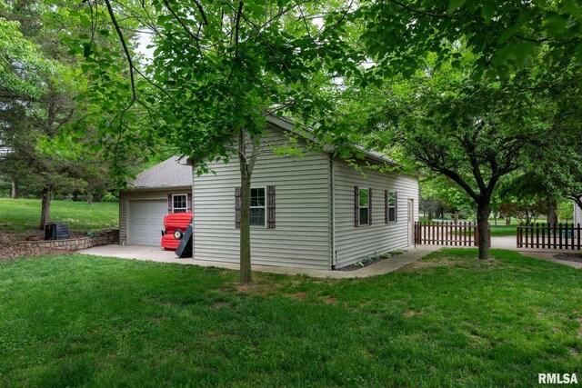 1300 W Brewster Rd, Herrin, IL 62948 - view of side of property featuring a central air condition unit and a detached garage