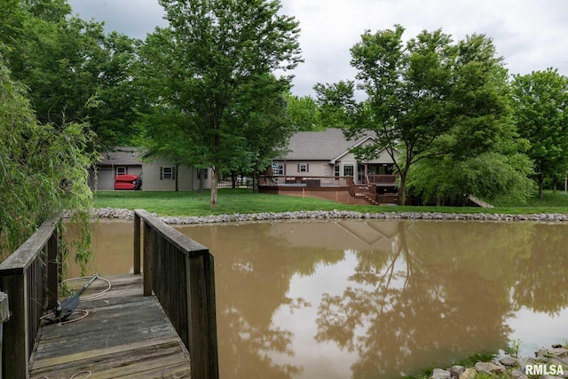 1300 W Brewster Rd, Herrin, IL 62948 - dock area with a lawn and a deck with water view
