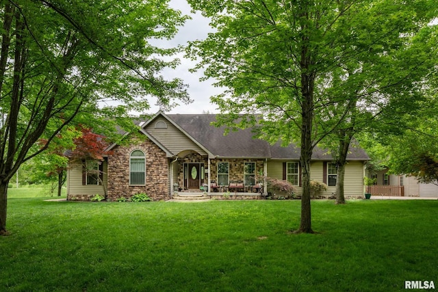 1300 W Brewster Rd, Herrin, IL 62948 - single story home featuring stone siding, a front yard, and covered porch