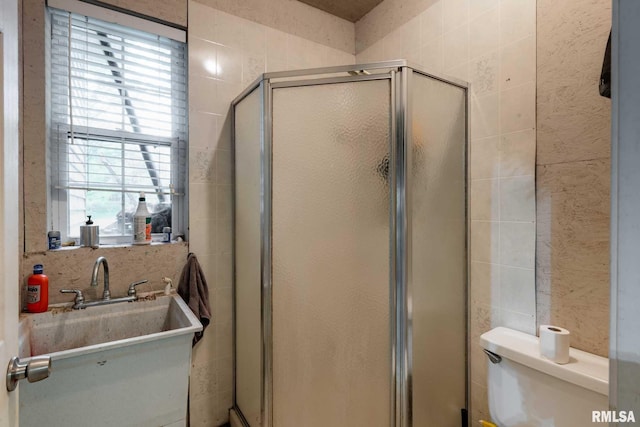 1300 W Brewster Rd, Herrin, IL 62948 - full bath featuring tile walls, a shower stall, and plenty of natural light