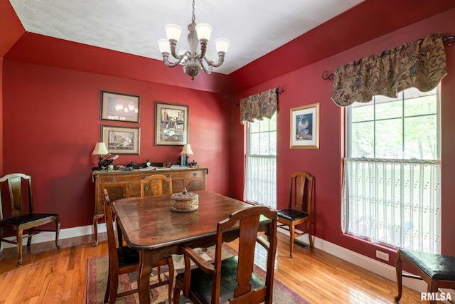 1300 W Brewster Rd, Herrin, IL 62948 - dining space featuring a chandelier and light wood-type flooring
