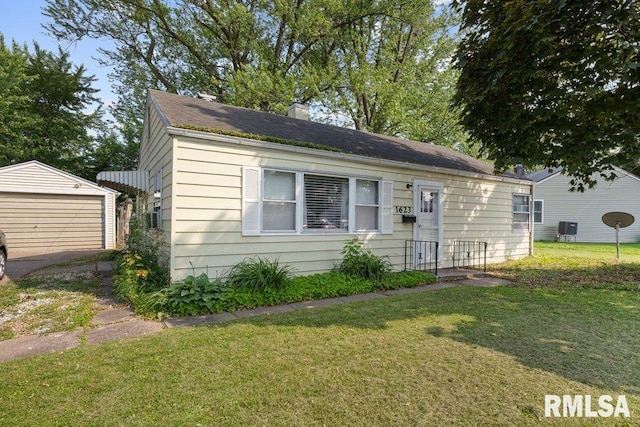 1623 Alcoa Ave, Bettendorf, IA 52722 - bungalow featuring a front yard, an outbuilding, a garage, and a chimney