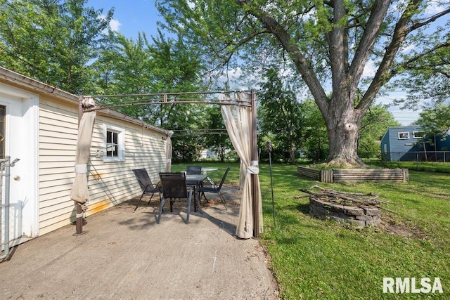 1623 Alcoa Ave, Bettendorf, IA 52722 - view of patio with an outdoor fire pit and outdoor dining area