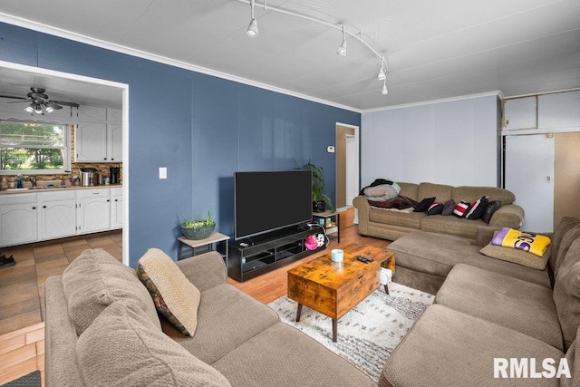 1623 Alcoa Ave, Bettendorf, IA 52722 - living area with crown molding, track lighting, and ceiling fan
