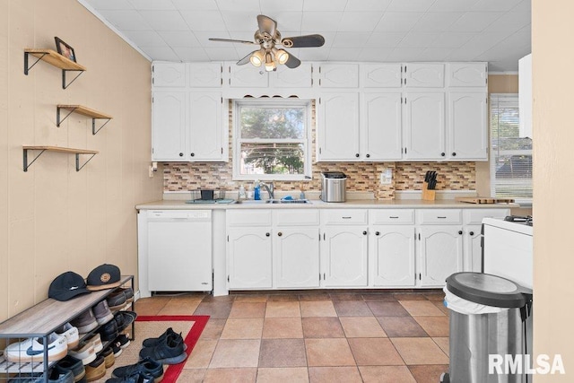 1623 Alcoa Ave, Bettendorf, IA 52722 - kitchen with white dishwasher, a ceiling fan, healthy amount of natural light, and white cabinets