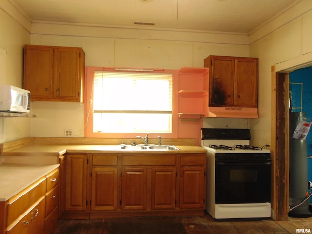 15321 Cherry St, Carterville, IL 62918 - kitchen with white appliances, under cabinet range hood, crown molding, light countertops, and brown cabinets