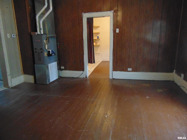 15321 Cherry St, Carterville, IL 62918 - unfurnished room featuring hardwood / wood-style flooring, wooden walls, and heating unit