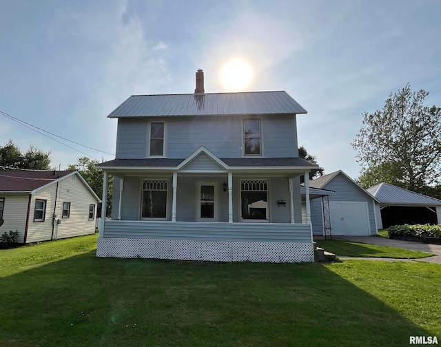 212 S E St, Cambridge, IL 61238 - view of front of property with covered porch, a front yard, driveway, a metal roof, and a chimney