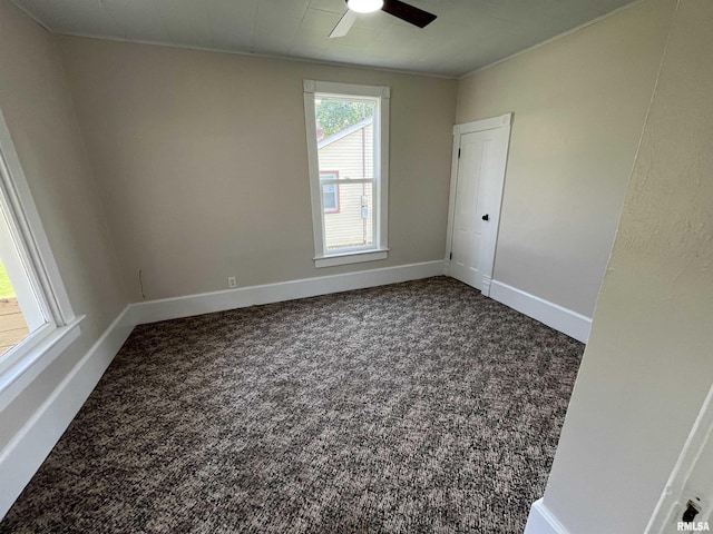212 S E St, Cambridge, IL 61238 - carpeted empty room featuring ceiling fan and baseboards