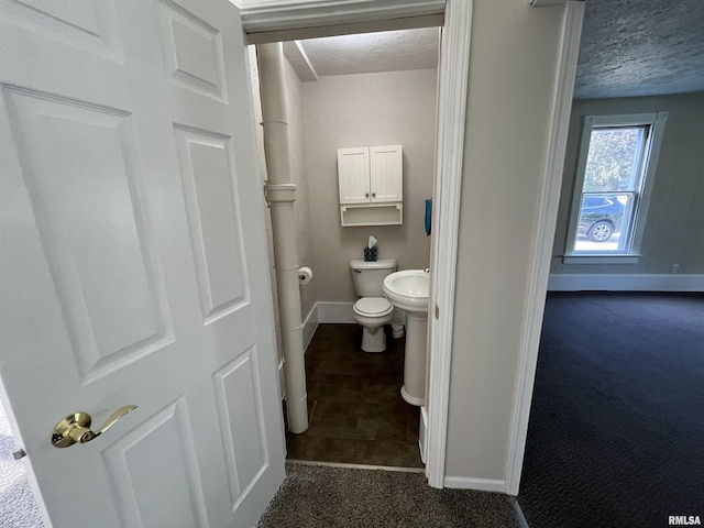 212 S E St, Cambridge, IL 61238 - bathroom featuring baseboards and a textured ceiling