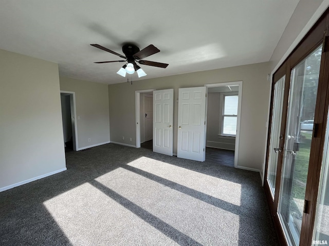 212 S E St, Cambridge, IL 61238 - unfurnished bedroom featuring dark colored carpet and ceiling fan