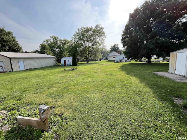 212 S E St, Cambridge, IL 61238 - view of green lawn featuring a storage shed