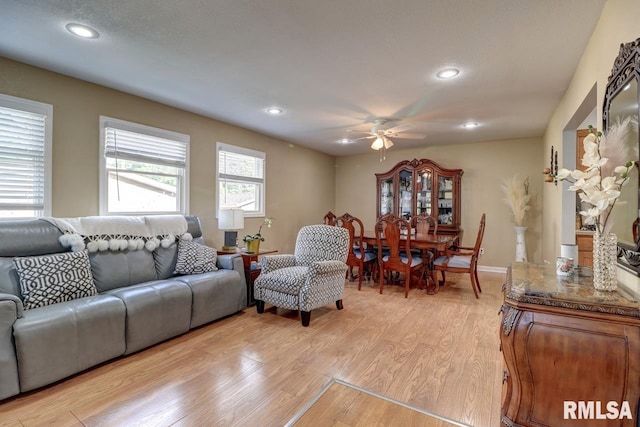 2410 Barker St, Clinton, IA 52732 - living room featuring a ceiling fan, light wood finished floors, and recessed lighting