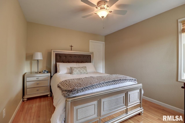 2410 Barker St, Clinton, IA 52732 - bedroom featuring hardwood / wood-style flooring and ceiling fan