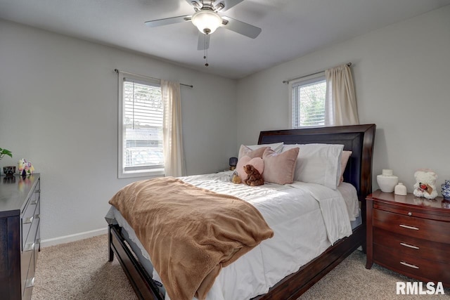 2410 Barker St, Clinton, IA 52732 - carpeted bedroom featuring baseboards and ceiling fan