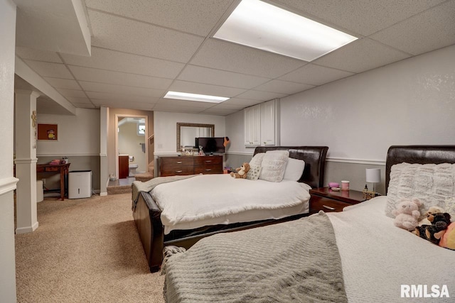 2410 Barker St, Clinton, IA 52732 - bedroom featuring a drop ceiling, light carpet, and ensuite bath