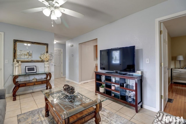 2410 Barker St, Clinton, IA 52732 - living area with a ceiling fan and tile patterned flooring