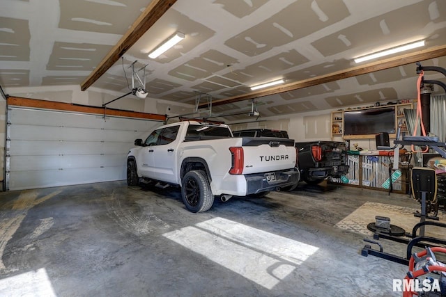 2410 Barker St, Clinton, IA 52732 - garage featuring a garage door opener