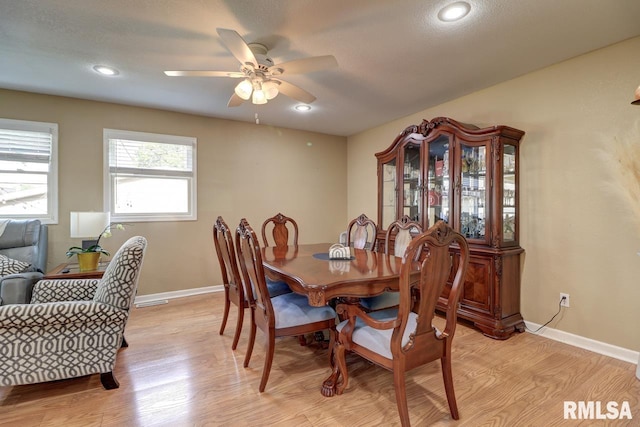 2410 Barker St, Clinton, IA 52732 - dining area with light wood finished floors, a ceiling fan, and recessed lighting