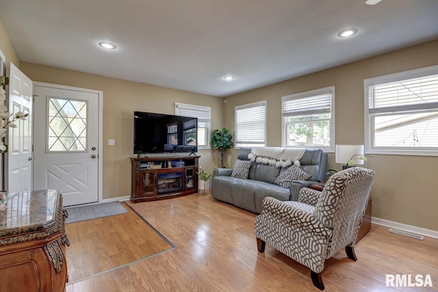 2410 Barker St, Clinton, IA 52732 - living room with light wood-style flooring and recessed lighting