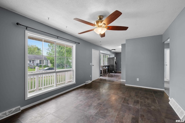 409 W 30th Ave, Milan, IL 61264 - empty room with ceiling fan and a textured ceiling