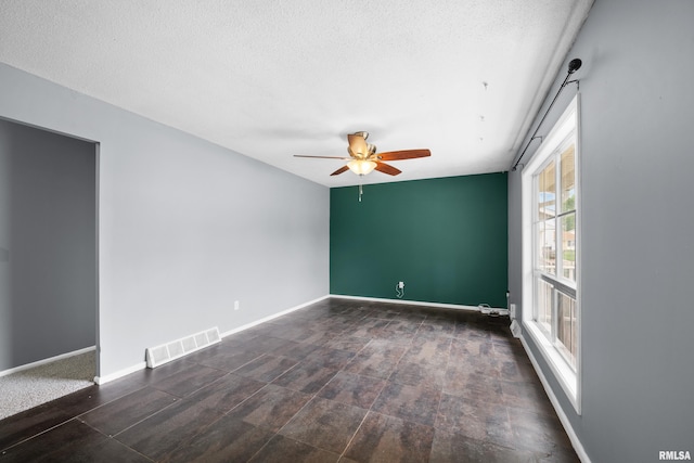 409 W 30th Ave, Milan, IL 61264 - unfurnished room featuring ceiling fan and a textured ceiling