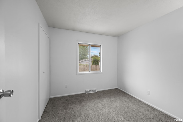 409 W 30th Ave, Milan, IL 61264 - carpeted empty room featuring baseboards and a textured ceiling