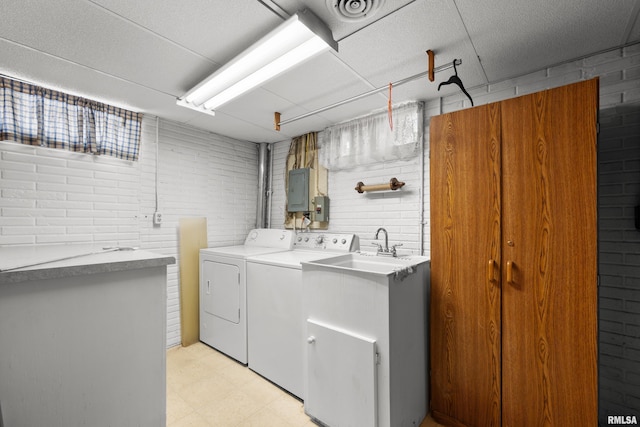 409 W 30th Ave, Milan, IL 61264 - washroom with washing machine and clothes dryer, electric panel, and light flooring