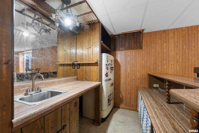 409 W 30th Ave, Milan, IL 61264 - kitchen with wooden walls and brown cabinets