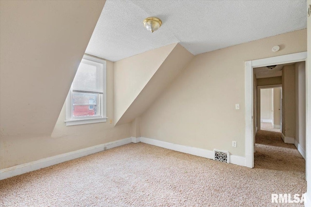 1045-1047 12th St, Rock Island, IL 61201 - bonus room with carpet, a textured ceiling, and lofted ceiling