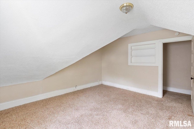 1045-1047 12th St, Rock Island, IL 61201 - bonus room with carpet flooring, lofted ceiling, and a textured ceiling