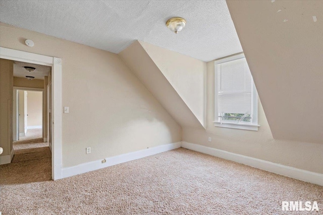 1045-1047 12th St, Rock Island, IL 61201 - bonus room featuring carpet floors, a textured ceiling, and lofted ceiling