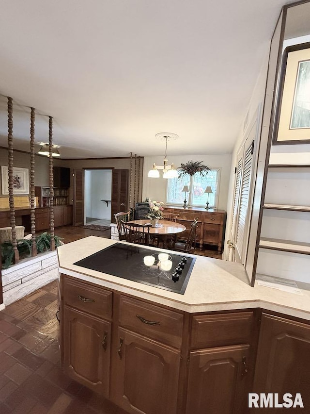 1701 Julianne Dr, Marion, IL 62959 - kitchen featuring black electric cooktop, light countertops, open floor plan, and dark brown cabinets