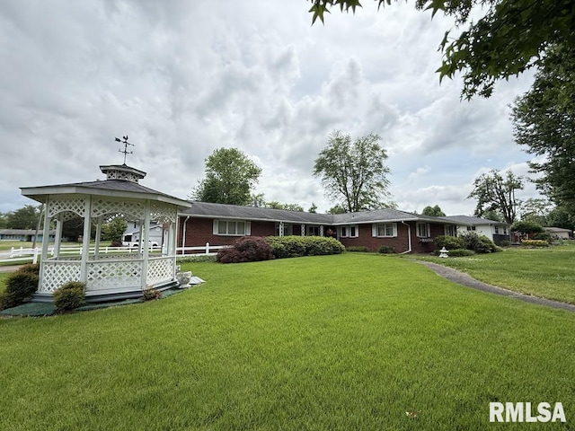 1701 Julianne Dr, Marion, IL 62959 - rear view of property with a gazebo, brick siding, and a yard