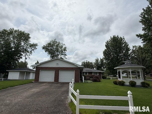 1701 Julianne Dr, Marion, IL 62959 - view of front of property with a gazebo, asphalt driveway, an attached garage, and brick siding