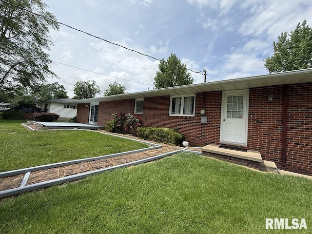 1701 Julianne Dr, Marion, IL 62959 - view of front facade with brick siding and a front lawn
