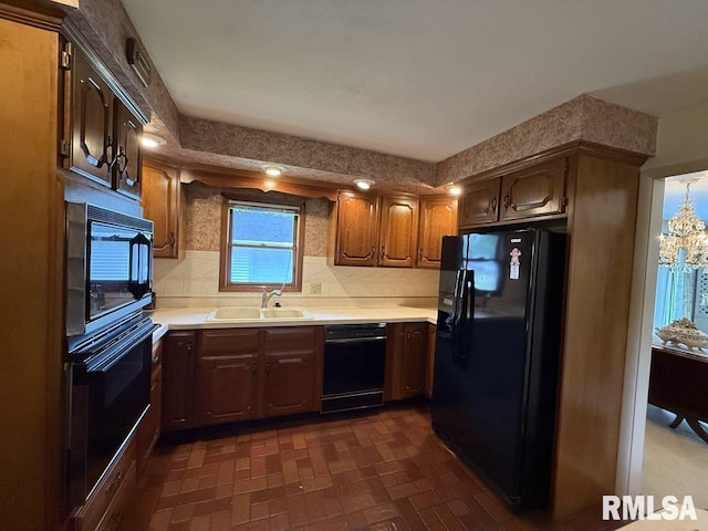 1701 Julianne Dr, Marion, IL 62959 - kitchen with black appliances, light countertops, decorative backsplash, and brick patterned flooring