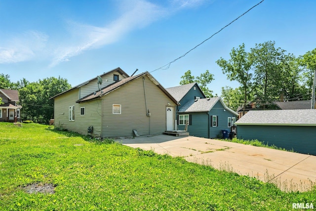 1108 Brown St, Davenport, IA 52804 - back of property featuring a yard and a patio