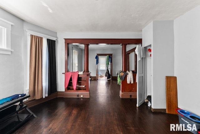 1625 14 1/2 St, Rock Island, IL 61201 - hall with decorative columns, wood finished floors, and healthy amount of natural light