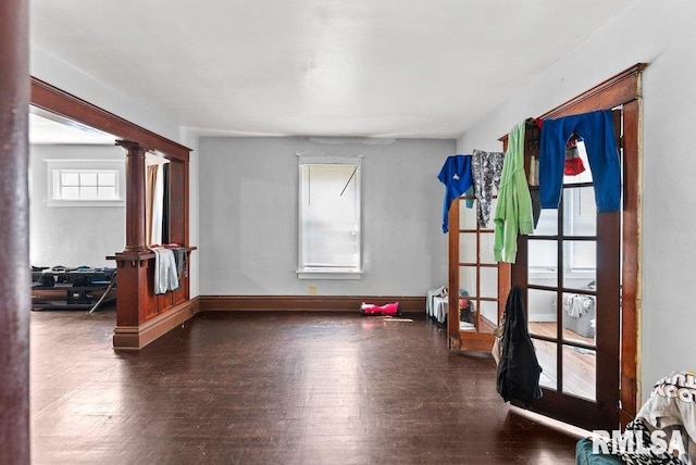 1625 14 1/2 St, Rock Island, IL 61201 - empty room with decorative columns and wood finished floors