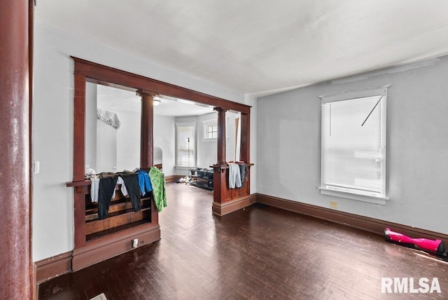 1625 14 1/2 St, Rock Island, IL 61201 - empty room with wood finished floors and decorative columns