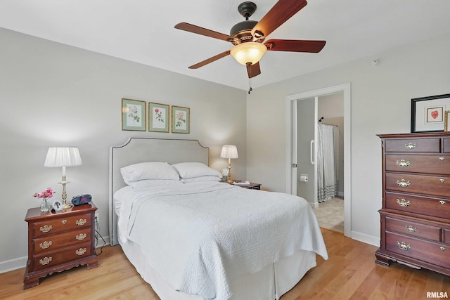 1237 Kimberly Rd, Bettendorf, IA 52722 - bedroom with light wood-style floors, ensuite bathroom, and a ceiling fan